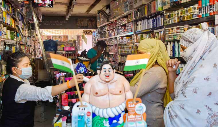 Bhopal: Women buy cosmetic items at a shop after the district administration allowed traders to open their establishments in a phased manner amid the ongoing COVID-19 lockdown | PTI