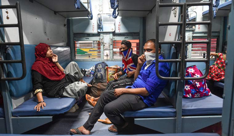 Passengers onboard a train at Charbagh railway station in Lucknow | PTI