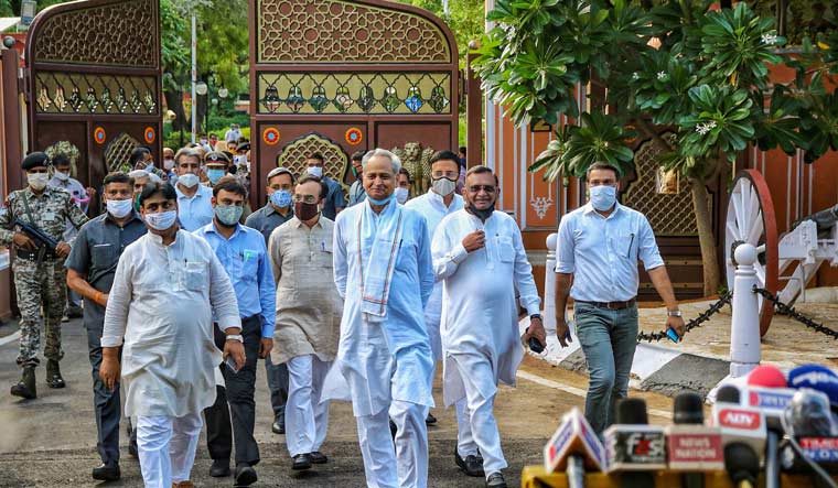 Rajasthan Chief Minister Ashok Gehlot along with senior Congress leaders and MLAs arrives to address media outside Raj Bhawan, in Jaipur on July 24 | PTI