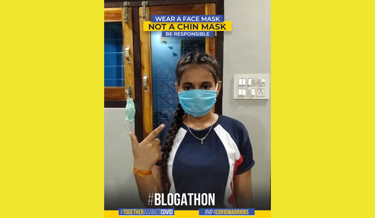 A young girl sharing a message on the importance of face mask during the 'blogathon'
