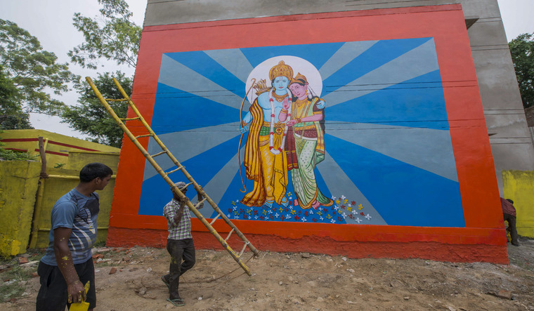 Workers paint the streets as part of preparations for the groundbreaking ceremony of Ram mandir in Ayodhya | AP