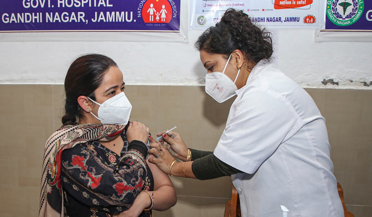 A medic administers COVID vaccine to a doctor in Jammu | PTI