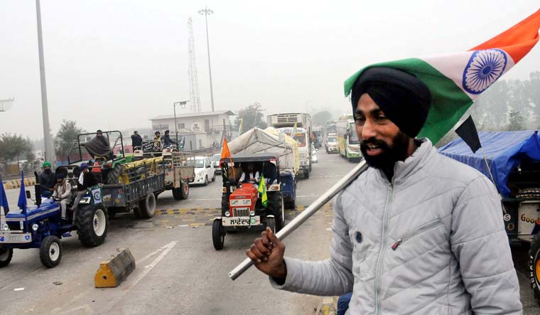 Haryana farmers welcome farmers of Punjab moving towards Delhi to take part in their January 26 tractor rally, as part of the ongoing agitation against farm laws, at Shambu Punjab-Haryana border near Patiala | PTI