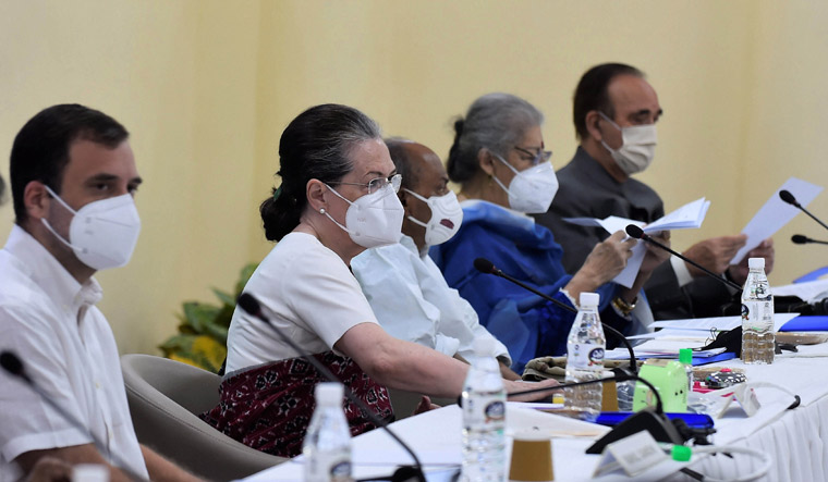 Congress interim president Sonia Gandhi with party leader Rahul Gandhi and others during the Congress Working Committee (CWC) meeting | PTI