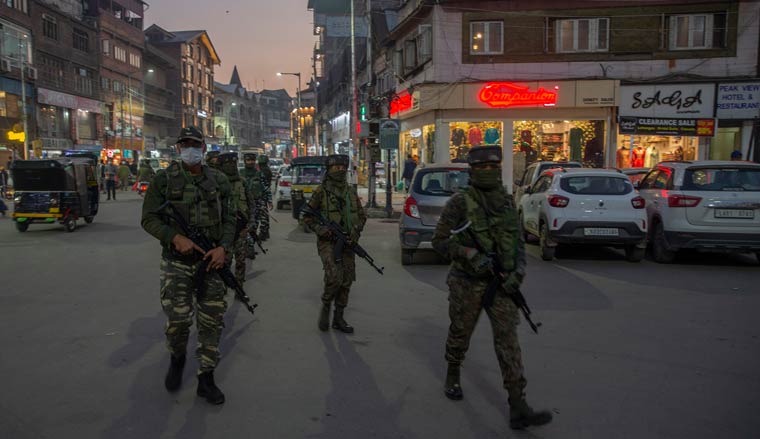 Paramilitary soldiers patrol during a surprise check operation in Srinagar | AP