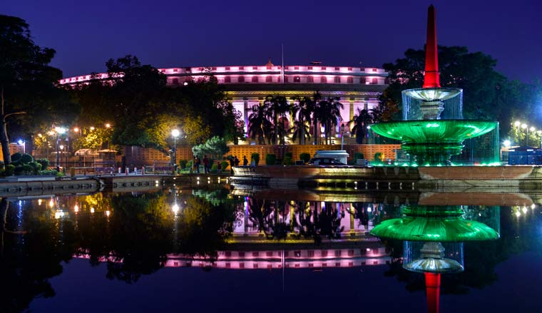 Parliament building illuminated with lights as India crossed the 1 billion COVID-19 vaccination milestone | PTI