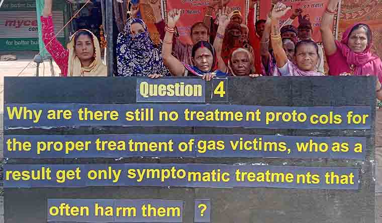 Bhopal gas tragedy survivors demonstrate with a placard with their fourth question on Friday | Sourced image