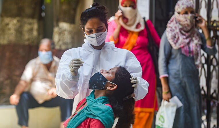 A medic conducts COVID-19 testing at Jain Hospital, as coronavirus cases surge in Mumbai | PTI