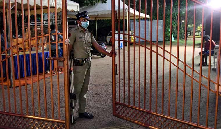 Police personnel stand guard at Karthika Thirunal Government School for Girls Manacadu on the eve of counting day of Kerala Assembly Polls in Thiruvananthapuram | PTI