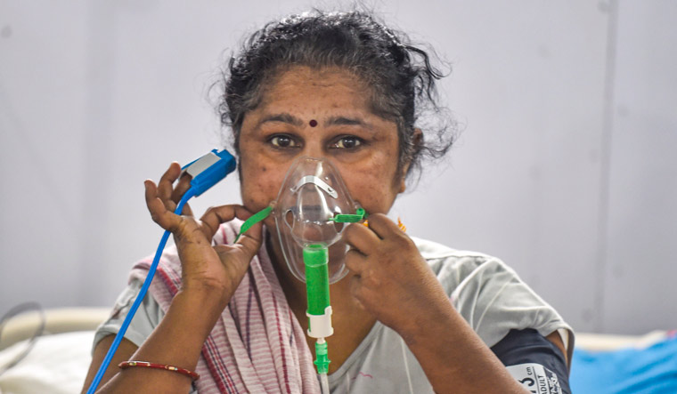 A COVID-19 patient receives treatment at newly constructed COVID Care Centre at Ramlila Maidan  | PTI