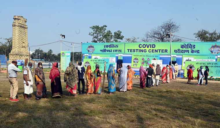 Pilgrims stand in queue for COVID-19 test at a transit camp for the Gangasagar Mela | Salil Bera