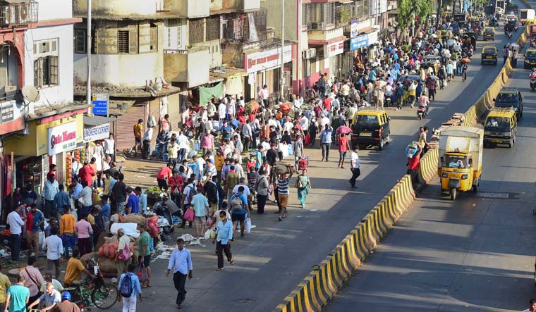 People visit a crowded Dadar market in Mumbai | PTI