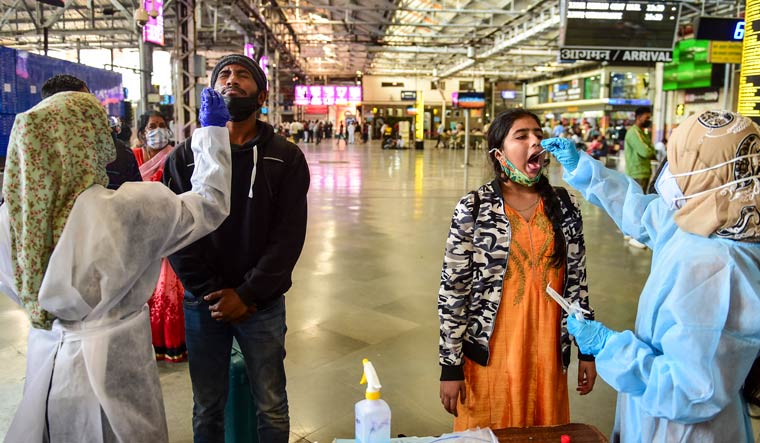 BMC health workers collect swab samples of passengers at Chatrapati Shivaji Maharaj Terminus | PTI