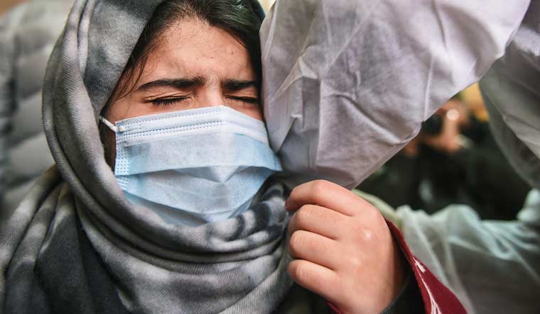 A student receives a dose of COVID-19 vaccine  at a centre in Srinagar | PTI