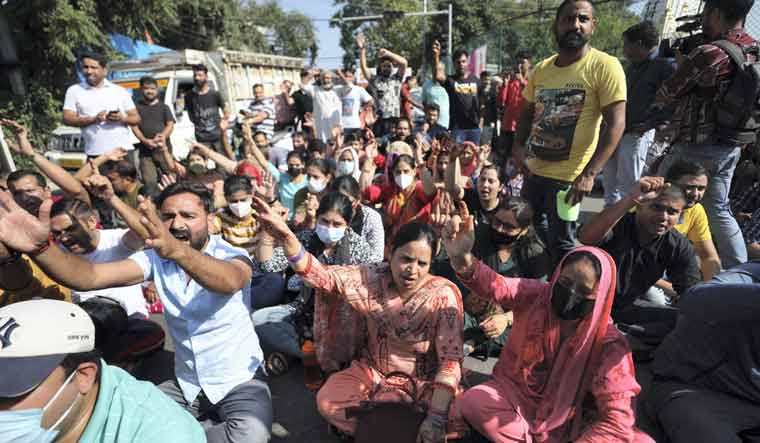 Kashmiri Pandit employees block Jammu-Poonch highway during a protest | PTI