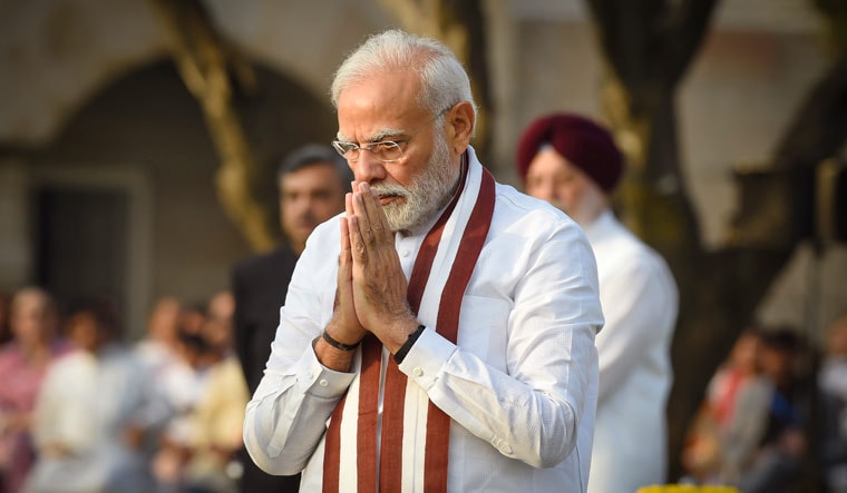 Prime Minister Narendra Modi pays homage to Mahatma Gandhi on the occasion of his birth anniversary, at Rajghat in New Delhi, Sunday, Oct. 2, 2022 | PTI