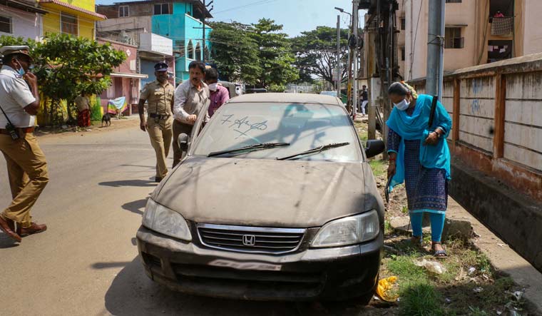 Security personnel check a parked vehicle after an LPG cylinder exploded inside a car recently, in Coimbatore | PTI