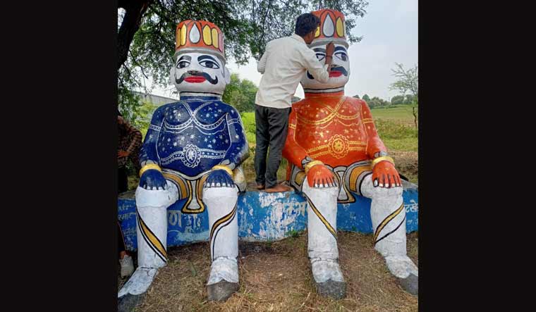 Ravana (in blue) and Kumbhakarna idols getting painted afresh at Bhatkhedi ahead of Dusshera