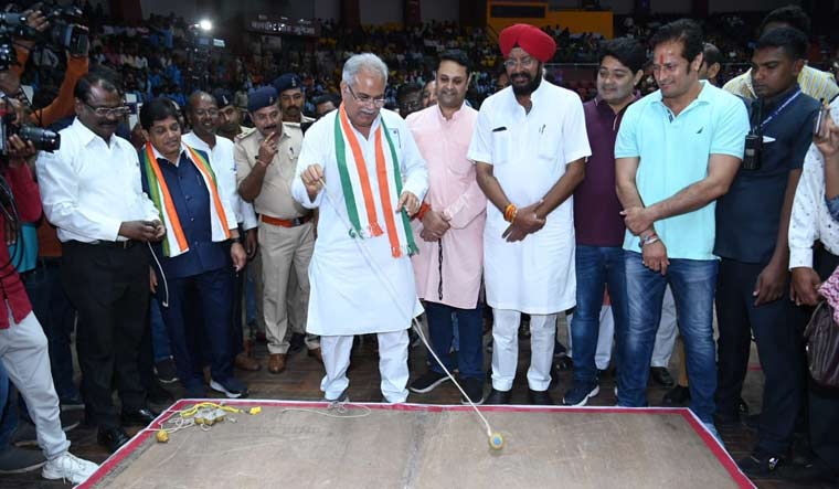 Chief minister Bhupesh Baghel plays traditional 'bhoura' (spin-top game) after inaugurating maiden 'Chhattisgarhiya Olympics' in Raipur on Thursday