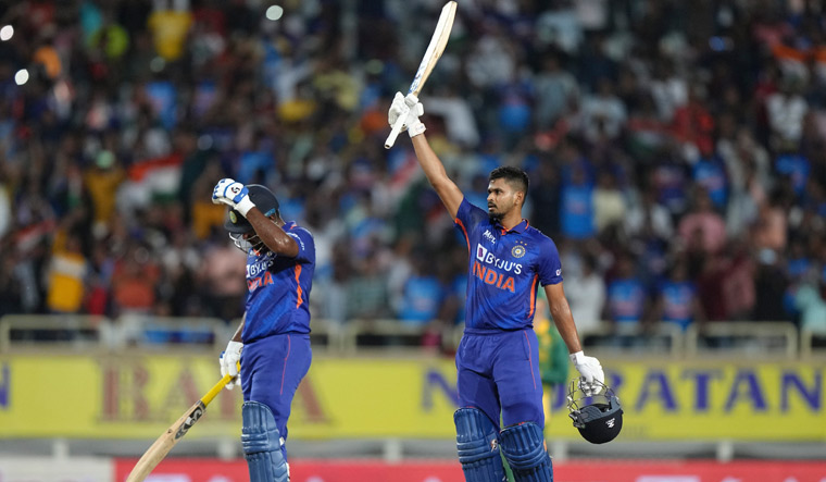 Shreyas Iyer raises his bat to celebrate his century | AP