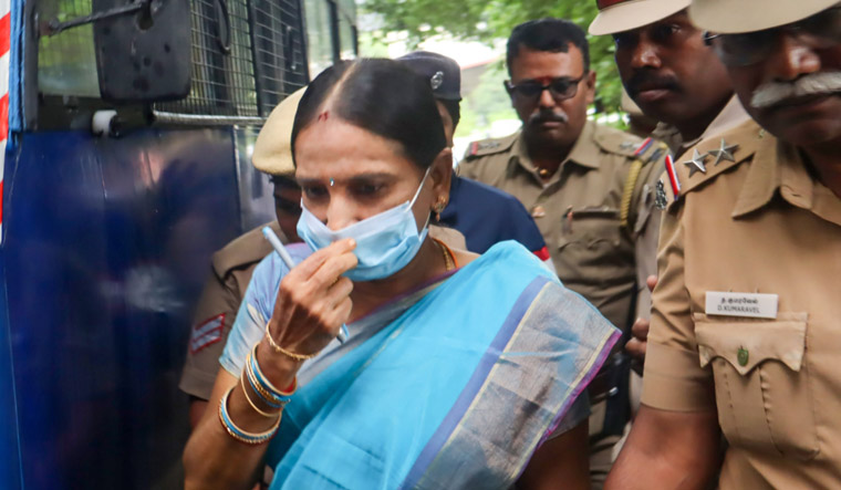 Nalini Sriharan, one of the seven convicts in the Rajiv Gandhi assassination case, arrives at Katpadi police station amid tight security