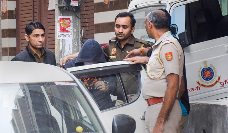 Aftab Ameen Poonawala, accused of killing his partner Shraddha Walkar, being brought to his residence at Chhatarpur as part of the ongoing investigation on Sunday (Nov 20) | PTI