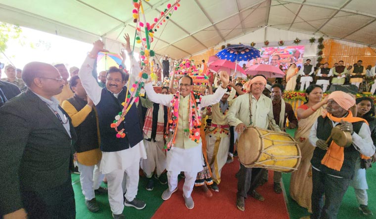 CM Shivraj Singh Chouhan participates in tribal dance in a PESA awareness convention at Pandhana in Khandwa on Wednesday.