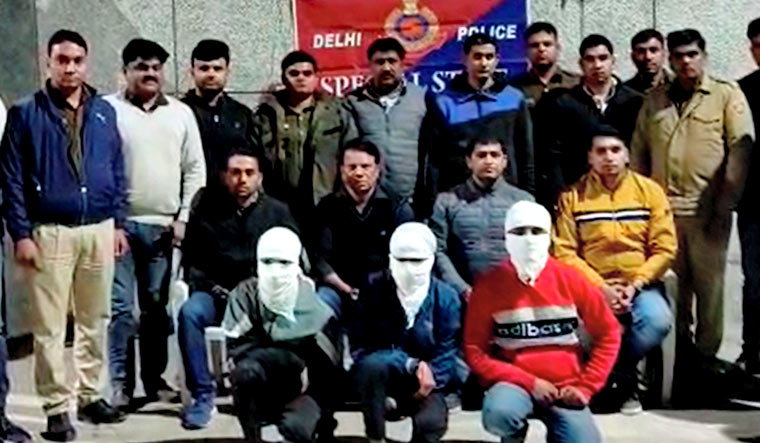 Delhi Police personnel with the three accused in the acid attack case | PTI/Delhi Police