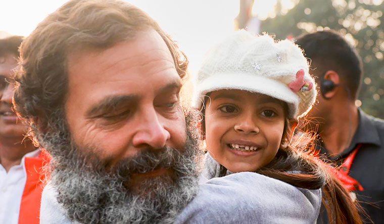 Congress leader Rahul Gandhi with a supporter during the Bharat Jodo Yatra in Delhi | PTI