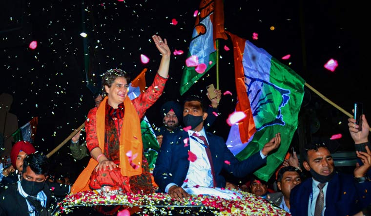 AICC general secretary Priyanka Gandhi Vadra waves at people during a roadshow in Amritsar | PTI