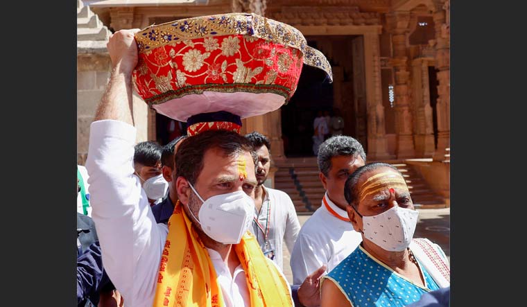 Rahul Gandhi carries offerings as he arrives at the Dwarkadhish Temple, in Dwarka | PTI