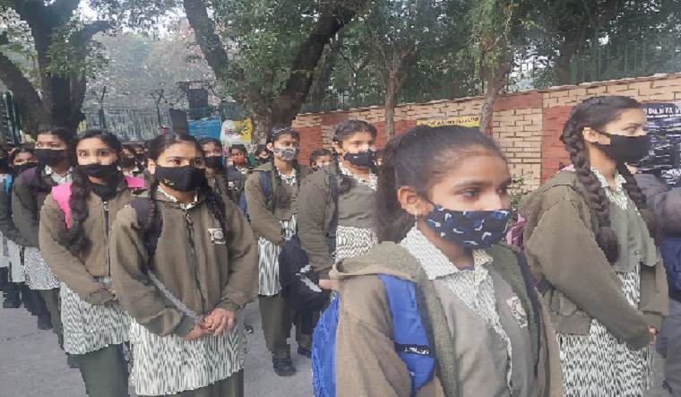 Children were seen wearing masks as they returned to schools [Image source: Twitter / Arvind Kejriwal