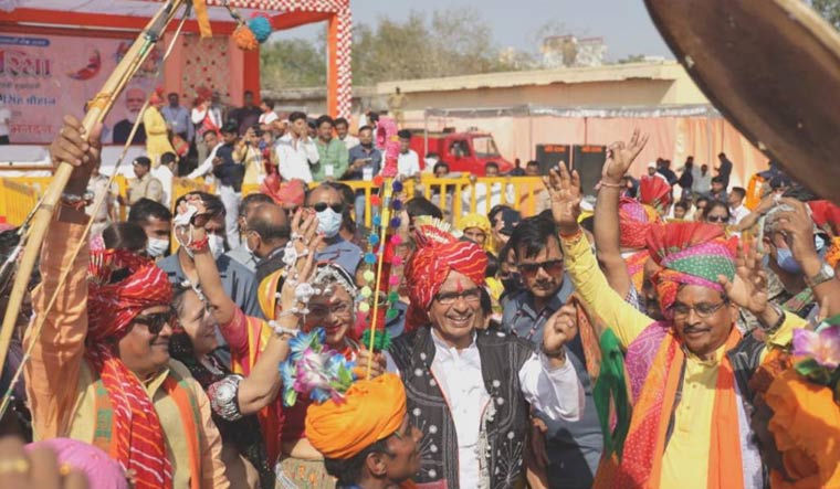 Madhya Pradesh Chief Minister Shivraj Singh Chouhan and wife Sadhna Singh take part in a tribal festival in Jhabua