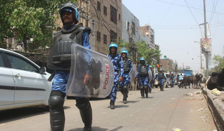 [File] Rapid Action Force personnel patrol after clashes between two communities at Jahangirpuri in Delhi | PTI