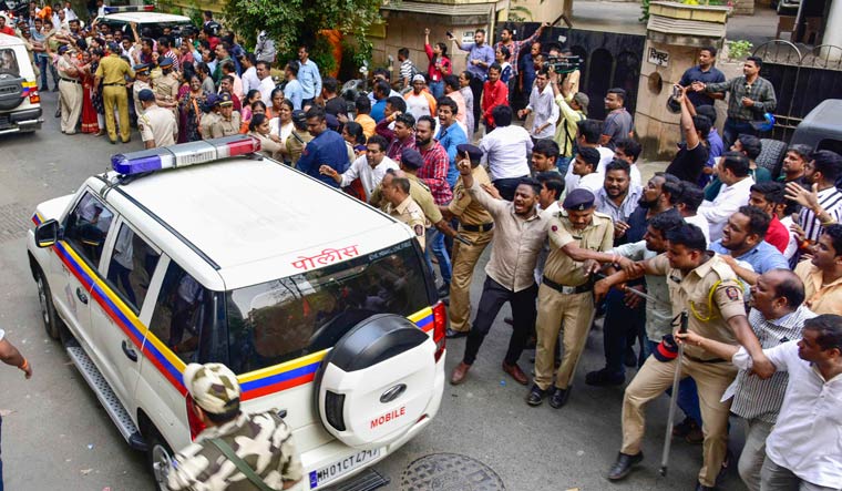 MLA Ravi Rana and his wife, MP Navneet Rana are escorted out of their house by police | PTI