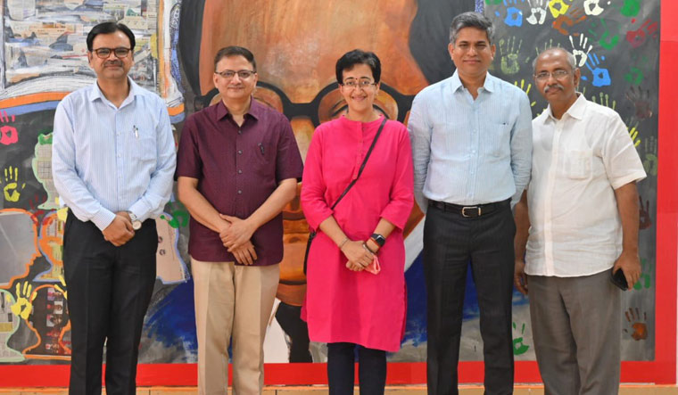 AAP MLA Atishi with education officials from Kerala | Twitter / AtishiAAP