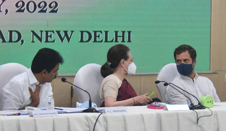 Congress president Sonia Gandhi with party leaders Rahul Gandhi and K.C. Venugopal during a CWC meeting at party headquarters in Delhi | PTI