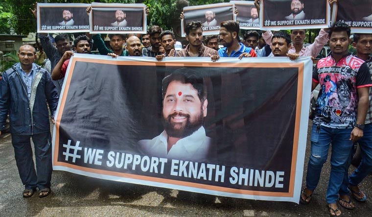 Supporters of rebel Shiv Sena leader Eknath Shinde outside his residence in Thane | PTI