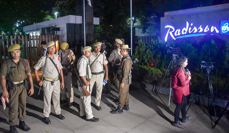  Security personnel stand guard outside the Radisson Blu hotel in Guwahati | PTI