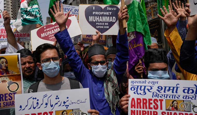 Muslims shout slogans as they react to the derogatory references to Prophet Muhammad during a protest in Mumbai | AP