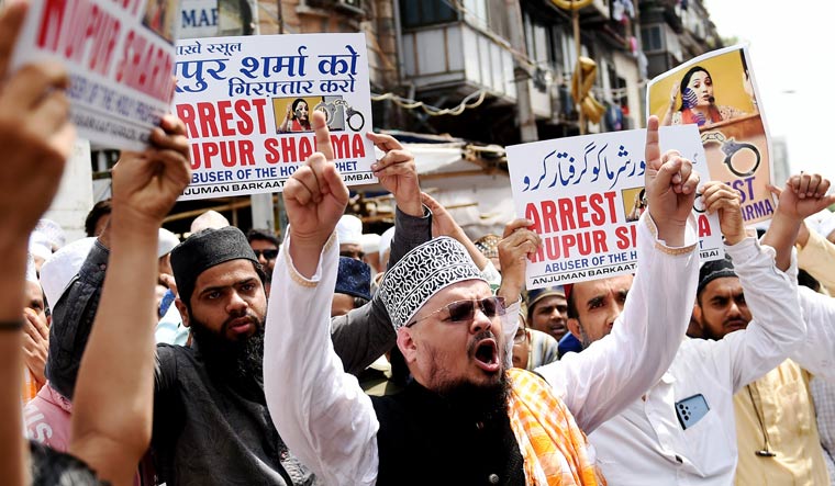 Activists shout slogans as they protest against the remarks of suspended BJP leader Nupur Sharma, in Mumbai | PTI