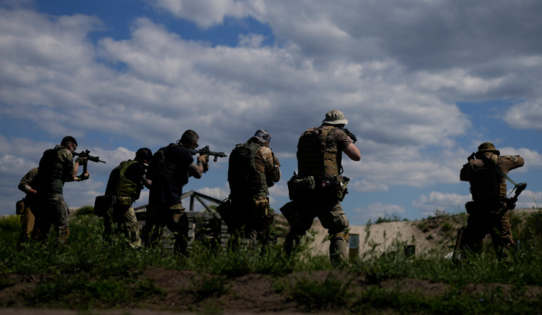 Civilian militia men hold shotguns during training at a shooting range in outskirts Kyiv | AP