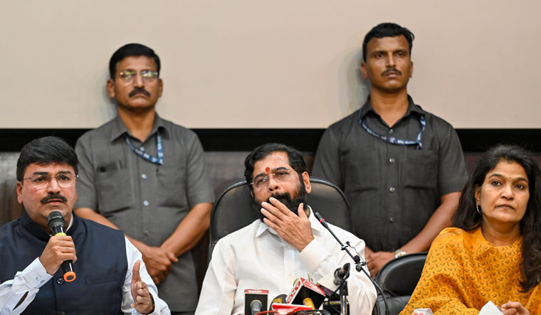 Shiv Sena MP Rahul Shewale speaks as Maharashtra Chief Minister Eknath Shinde and party MP Bhavana Gawali look on during a press conference in Delhi | PTI