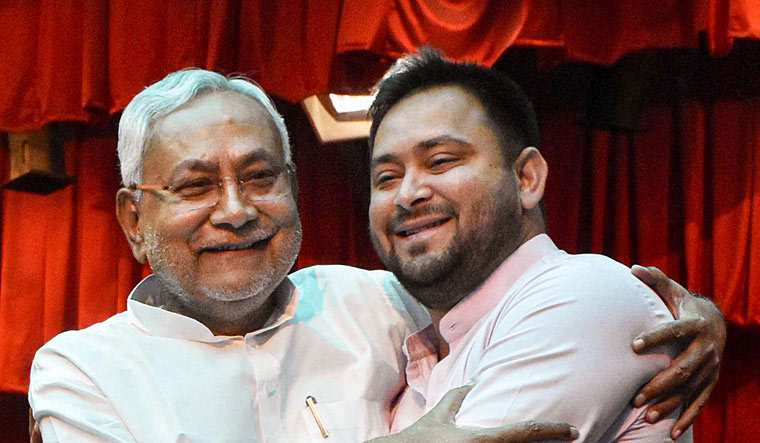 Bihar Chief Minister Nitish Kumar being greeted by Deputy Chief Minister Tejashwi Yadav after taking oath | PTI