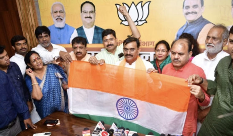 MP BJP president Vishnu Dutt Sharma inaugurates national flag sale facilitation centre at the party headquarters in Bhopal 