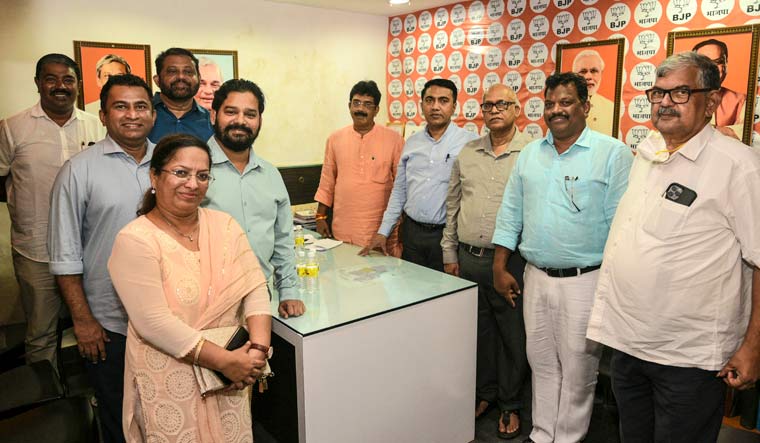 Goa Chief Minister Pramod Sawant and BJP state president Sadanand Shet Tanavade with eight Congress MLAs who joined the party | PTI