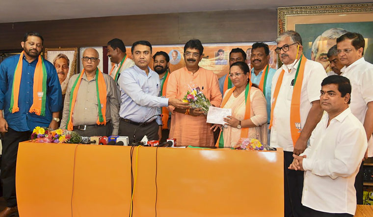 Goa Chief Minister Pramod Sawant and BJP state president Sadanand Shet Tanavade welcome eight Congress MLAs who joined the party, in Panaji | PTI