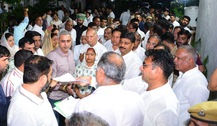 Congress MLAs, loyal to Ashok Gehlot, leave for the residence of Assembly Speaker C.P. Joshi for a meeting, in Jaipur on Sunday | PTI