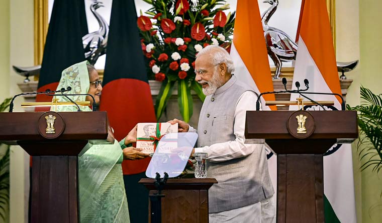 Prime Minister Narendra Modi with his Bangladeshi counterpart Sheikh Hasina during the release of a joint statement after their meeting at Hyderabad House | PTI