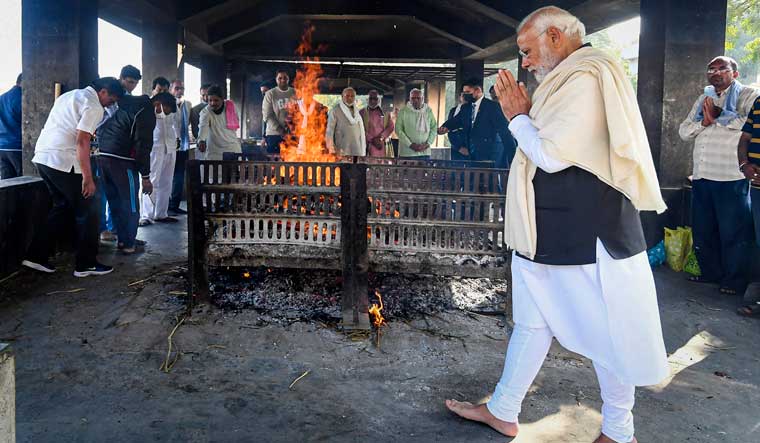 Prime Minister Narendra Modi performs last rites of his mother Heeraben Modi, in Gandhinagar on Friday | PTI